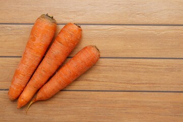 Carrots on wooden background. Healthy food.