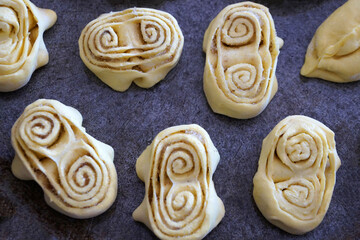 sweet pastries on a baking sheet cooked for baking food background