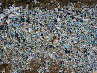 Aerial top view photo of large garbage pile at solid waste landfill