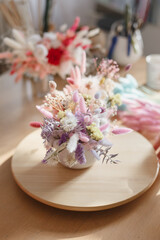 A bouquet of dried flowers of beautiful gentle tones. Bridal bouquet or bouquet as a gift for a holiday. Stabilized flowers