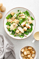 Caesar salad with parmesan cheese, grilled chicken meat and croutons