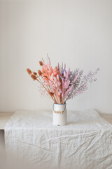 Bright trendy composition of dried flowers, home decor, a long-lasting gift of flowers and herbs