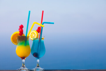 Exotic decorated Cocktails over the sea background
