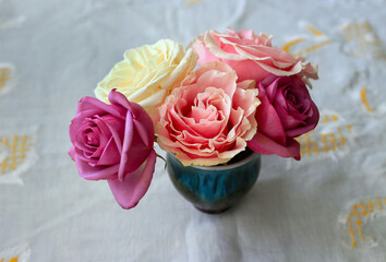 Delicate small bouquet of beautiful colorful roses