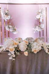 wedding table newlyweds decorations green, white and pink flowers.