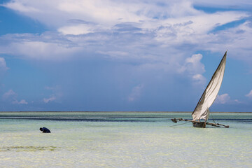 Muslim man praying in low tide