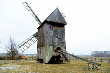 wooden mill, a koźlak windmill located near the village of wood in mazovia, poland March 2021 snowfall
