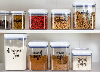Neatly organized transparent canisters for baking ingredients - 421613545