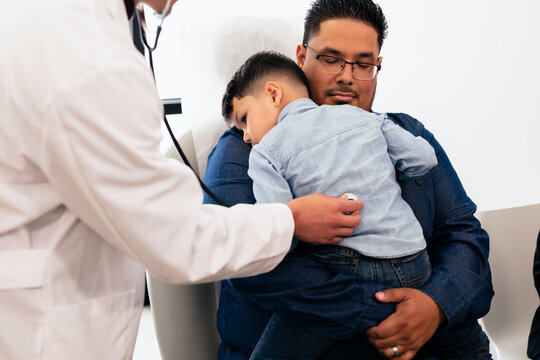 Doctor examining young hispanic toddler with stethescope