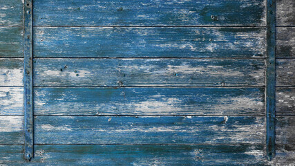 old abstract blue colorful painted exfoliate rustic wooden boards / wooden gate / wooden door texture, with teel bolt - wood background shabby