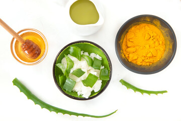 Aloe, turmeric ,honey and coconut. Natural herbal skin care products, top view ingredients. Facial and body treatment