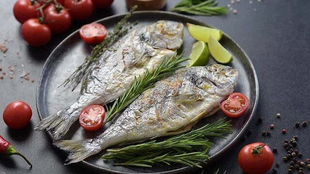 Delicious dorado baked on a grill with spices and herbs. Dorado cooked on about