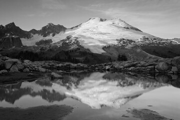 USA, Washington State. Mount Baker National Recreation Area, Park Butte, Mount Baker reflected in alpine tarn.
