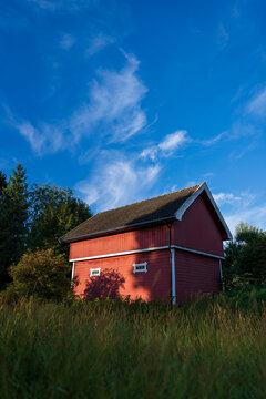 Red "stabbur", a traditional storehouse of a farm in Scandinavia.