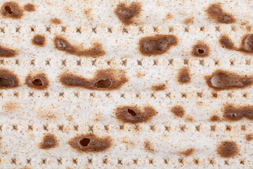 Matzah. Jewish traditional Passover bread. Pesach celebration symbol. With some free space for your text or sign . Close-up.