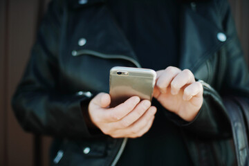 Woman taking a selfie on the street.