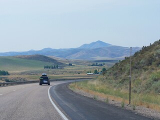 Winding road along hills and mountains in Utah, USA.