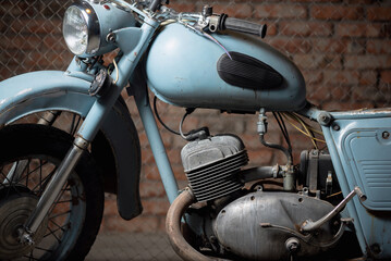 Fototapeta na wymiar Old garage concept background. Retro style dusty motorcycle in the workshop.
