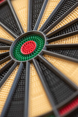 Close-up of a dartboard with pinholes for the darts