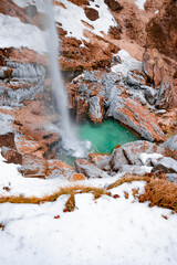 geothermal waterfall in the mountains