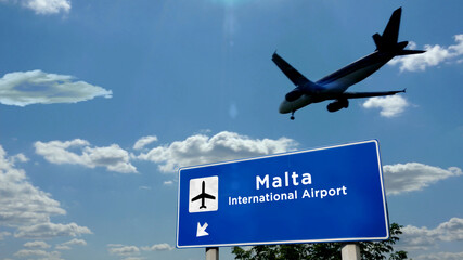 Plane landing in Malta airport with signboard