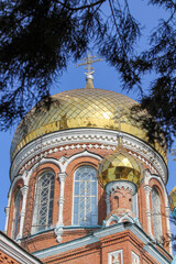 Fototapeta na wymiar Church against the sky. Temple with golden domes.