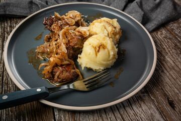 Fried liver with onion.
