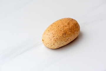 fresh baked bun (roll) on a white