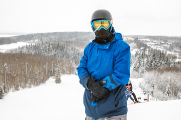 Fototapeta na wymiar Person with a snowboard on the ski resort