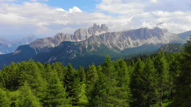 Aerial view Italian Dolomites. Sumer in Dolomiti Dolomites Mountains. Mountain forest in Italian Alps. Croda Da Lago Ridge in Dolomites Mountains. Drone video in beautiful Italian Dolomites Mountains
