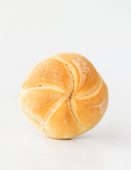 fresh baked bun (roll) on a white