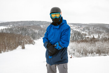Fototapeta na wymiar Person with a snowboard on the ski resort