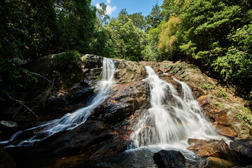 Fototapeta na wymiar Small waterfall in Sri Lanka hills