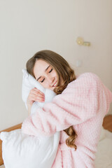 Happy rich young woman wear night robe in modern home hotel, good morning lifestyle concept