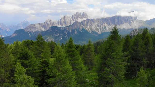 Aerial view Italian Dolomites. Sumer in Dolomiti Dolomites Mountains. Mountain forest in Italian Alps. Croda Da Lago Ridge in Dolomites Mountains. Drone video in beautiful Italian Dolomites Mountains