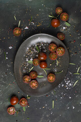 cherry tomatoes on a dark plate