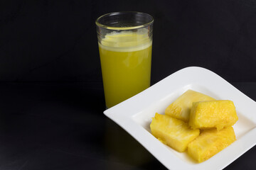 Pineapple fruit juice concept isolated on black background