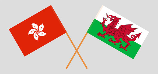 Crossed flags of Hong Kong and Wales. Official colors. Correct proportion
