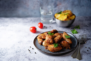 Spicy baked wings in a plate