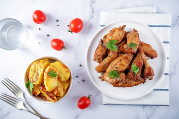 Spicy baked wings in a plate