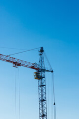 High factory structure and tower crane at industrial production area.
