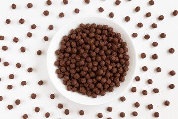 Plate of Chocolate cornflakes isolated on a white background.