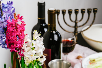 Passover celebration concept. bottle of wine, matzo, egg and lettuce