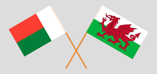 Crossed flags of Madagascar and Wales. Official colors. Correct proportion