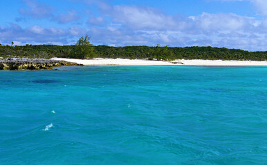 Clear blue waters of Exuma Cays with white-sand beaches, Bahamas.
