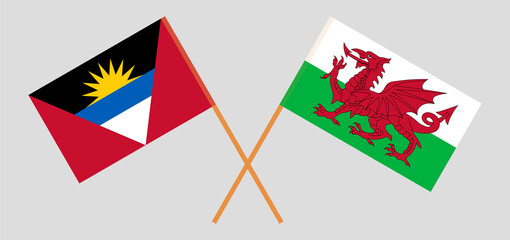 Crossed flags of Antigua and Barbuda and Wales. Official colors. Correct proportion