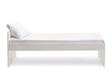 Studio shot of a single bed with a pillow