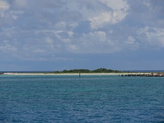 Wide shot of sand beaches with the old dock at Fort Jefferson, Dry Tortugas National Park.