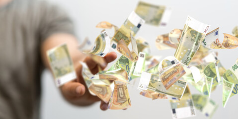 banking euro banknote in hand rain