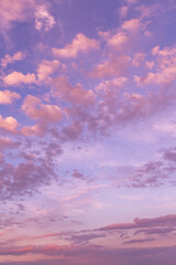 Dramatic sunrise, sunset pink violet blue sky with fluffy clouds abstract background texture